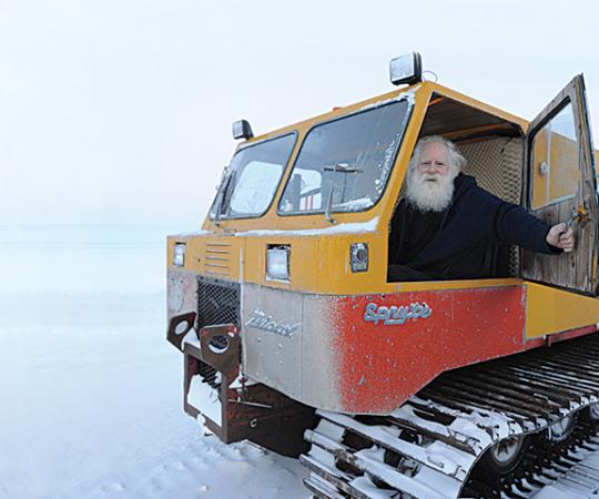Garry Beattie warms up his Thiokol Spryte Snowcat one chilly morning. He takes it everywhere and anywhere around Cambridge Bay. Photo by Herb Mathisen