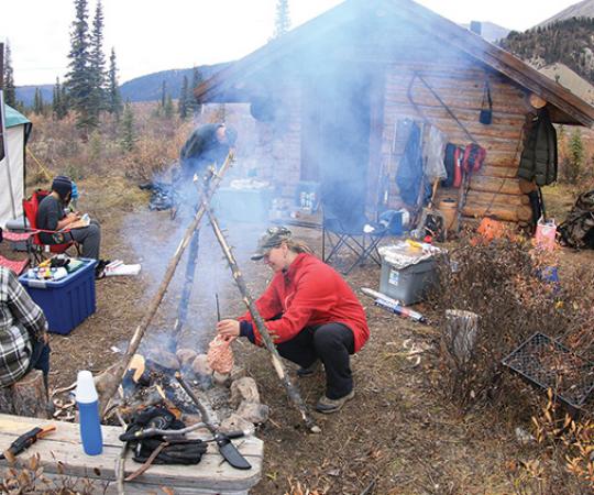 Nichole Richards of Norman Wells, NWT cooking up caribou heart. Photo by Nichole Richards