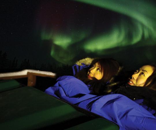 Stay Warm: Tourists view the aurora from a heated pod. Photo courtesy of Aurora Village.