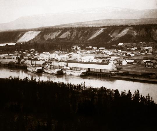 Riverfront roots: Whitehorse, circa the turn of the last century, where paddle-wheeled steamers lined the shores of the Yukon River to carry on good from the end of the White Pass railway.