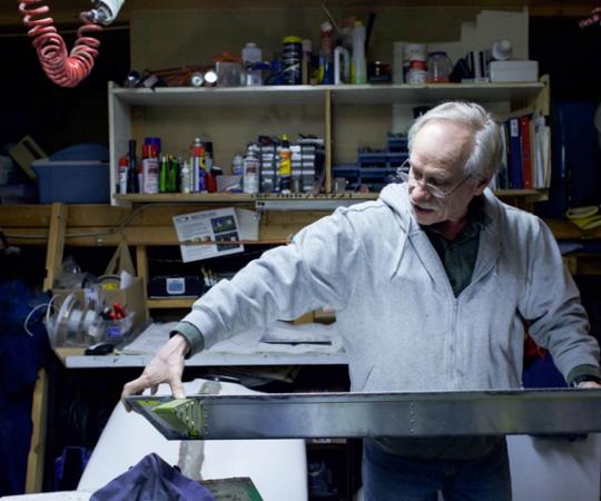 In his workspace, Holloway examines an aileron, a hinged piece that attaches to the wing. Once complete, the Sonex (that’s the name of the aircraft model) will measure 5.5 metres long and 6.7 metres wide. Photo by Hannah Eden/Up Here