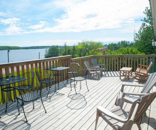 The front deck of the Mackenzie Rest Inn overlooks the mighty Mackenzie River. Photo by Herb Mathisen/Up Here