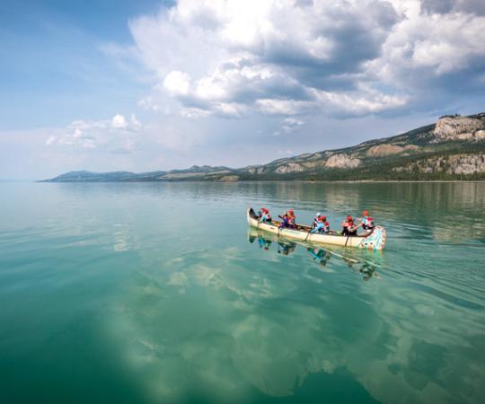 Paddlers cross Lake Laberge during the 2015 Yukon River Quest. Photo by Joel Krahn